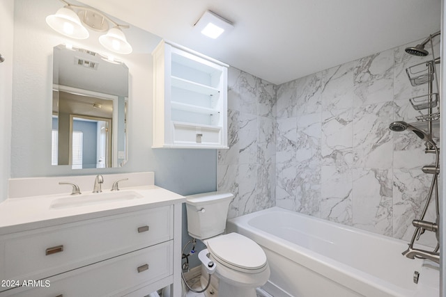 full bathroom featuring vanity, toilet, and tiled shower / bath