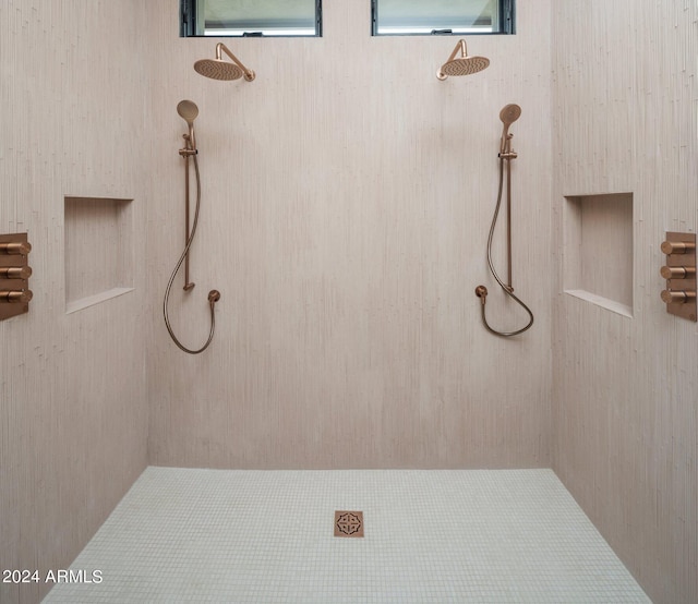 bathroom with tiled shower