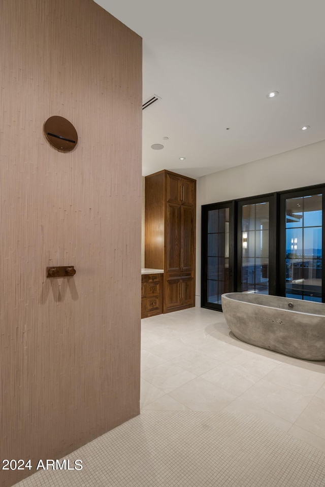 interior space featuring recessed lighting and tile patterned floors