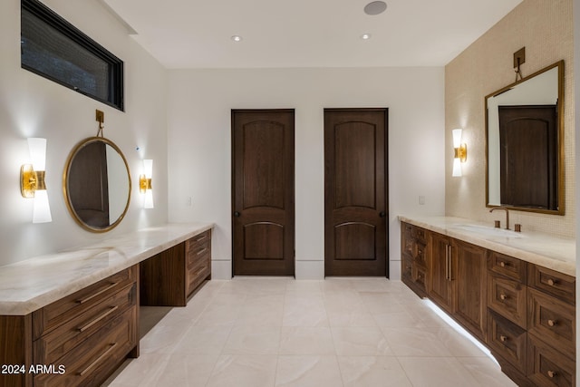 bathroom featuring tile patterned floors and vanity