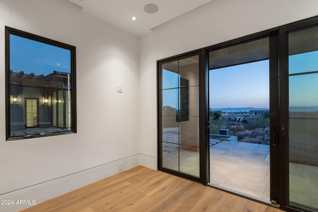 doorway to outside with wood finished floors