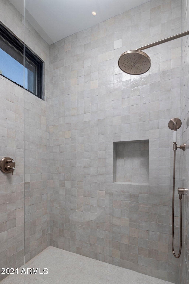 bathroom with tiled shower