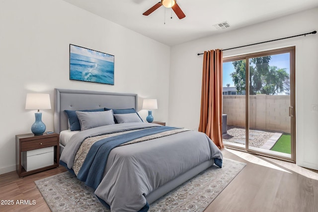 bedroom featuring visible vents, access to exterior, light wood-style floors, baseboards, and a ceiling fan