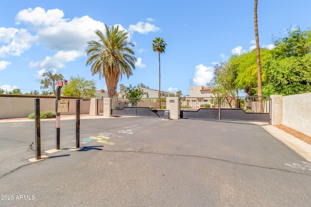view of road with a gated entry and a gate