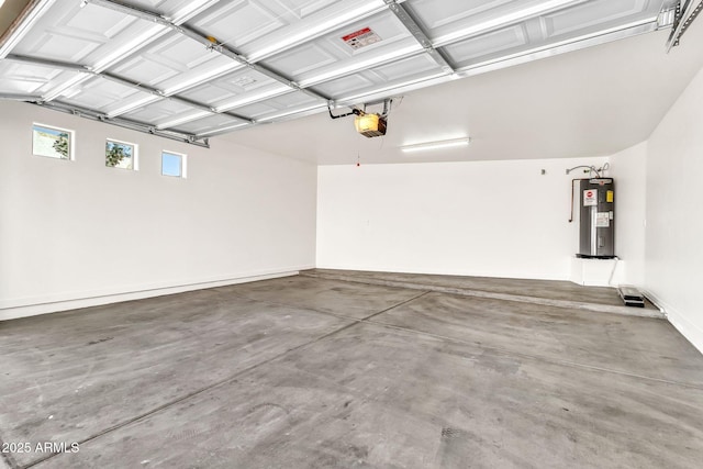 garage featuring a garage door opener and electric water heater