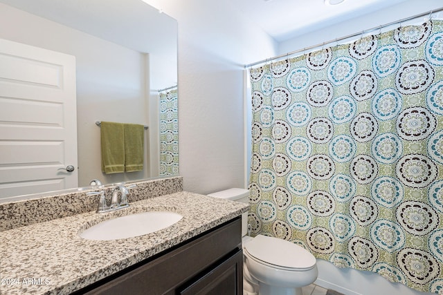 full bathroom with shower / bath combo, vanity, and toilet