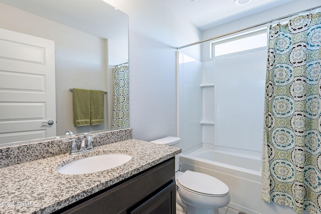 full bathroom featuring shower / tub combo with curtain, vanity, and toilet