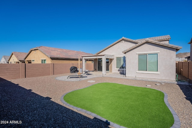 back of property featuring a patio and a pergola