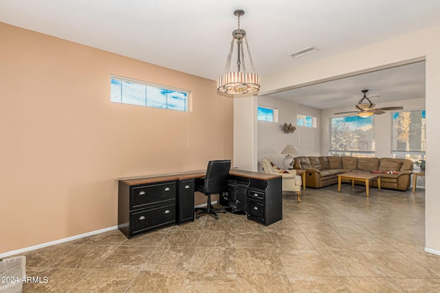 office area featuring a ceiling fan, visible vents, and baseboards