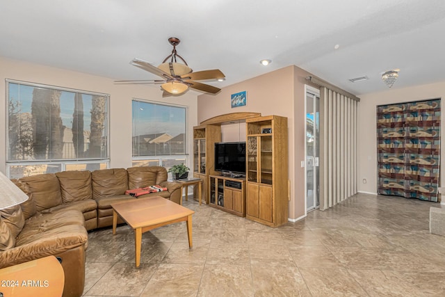 living area featuring ceiling fan and visible vents