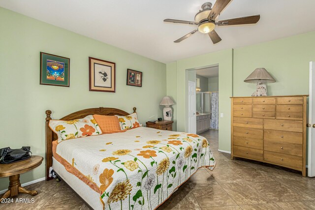 bedroom featuring ceiling fan, connected bathroom, and baseboards