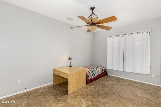 unfurnished bedroom with a ceiling fan, visible vents, and baseboards