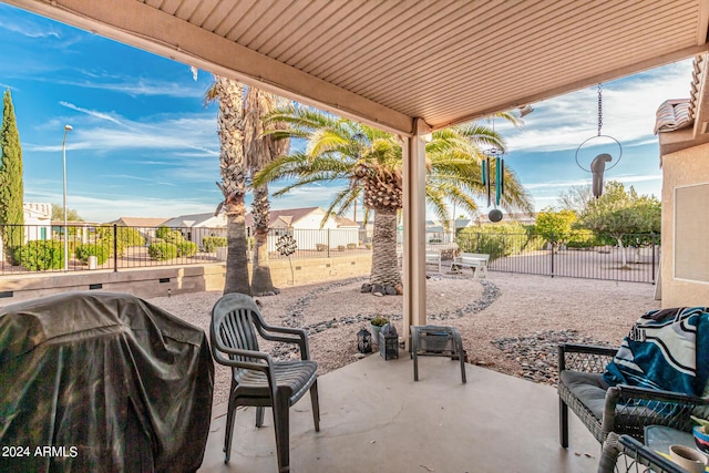 view of patio / terrace with a fenced backyard and a residential view