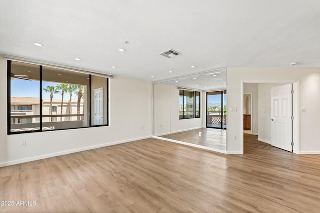 4200 N Miller Rd Unit 504, Scottsdale, AZ 85251 - spare room with light wood-type flooring and recessed lighting