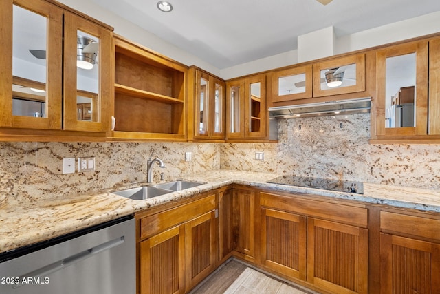 4200 N Miller Rd Unit 504, Scottsdale, AZ 85251 - kitchen with dishwasher, black electric stovetop, light stone countertops, brown cabinets, and extractor fan