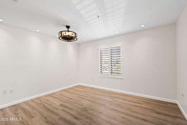 4200 N Miller Rd Unit 504, Scottsdale, AZ 85251 - unfurnished room with wood finished floors and recessed lighting