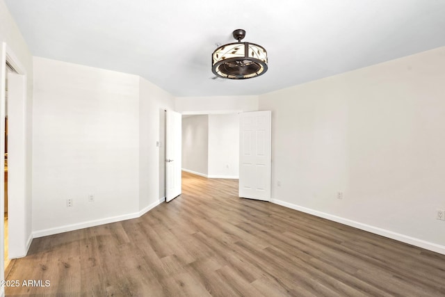 4200 N Miller Rd Unit 504, Scottsdale, AZ 85251 - spare room with wood finished floors and baseboards