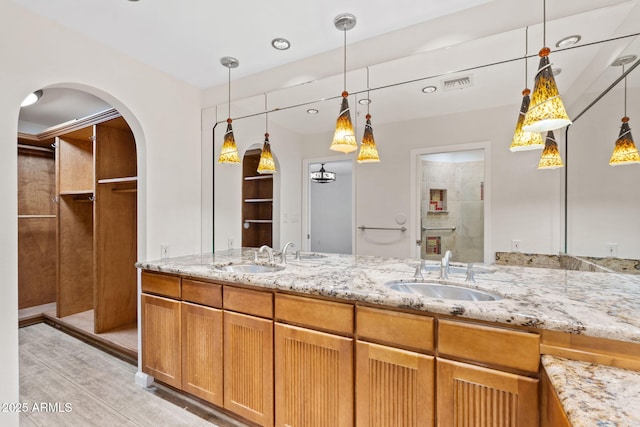 4200 N Miller Rd Unit 504, Scottsdale, AZ 85251 - full bathroom featuring double vanity and wood finished floors
