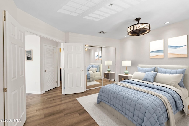 4200 N Miller Rd Unit 504, Scottsdale, AZ 85251 - bedroom featuring wood finished floors, a closet, and recessed lighting