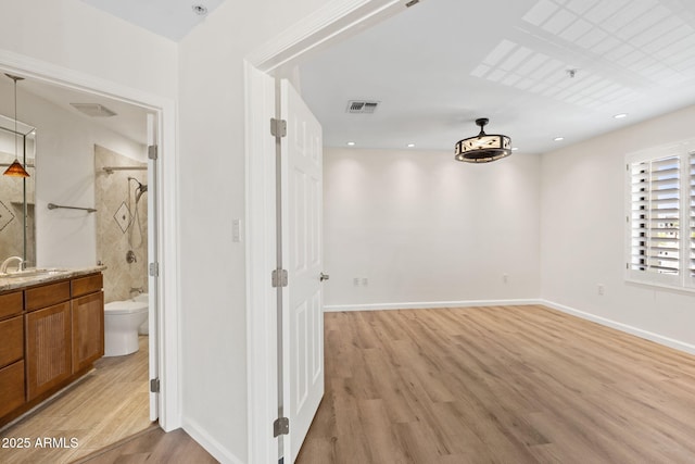 4200 N Miller Rd Unit 504, Scottsdale, AZ 85251 - unfurnished room with light wood-style flooring and fire sprinkler in ceiling