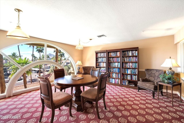 4200 N Miller Rd Unit 504, Scottsdale, AZ 85251 - carpeted dining room with a textured ceiling