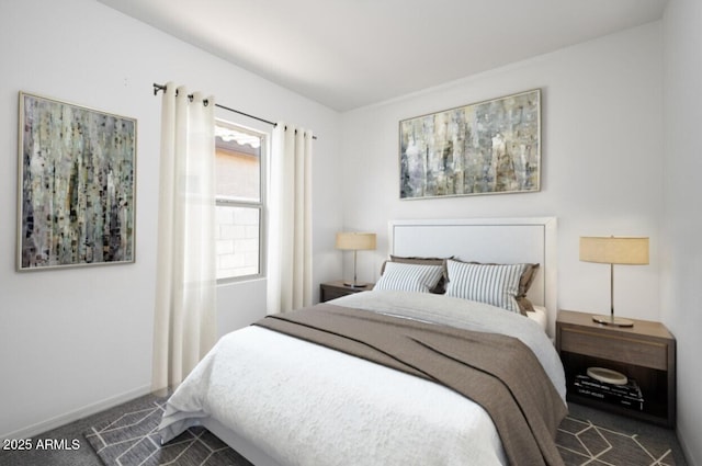 bedroom featuring carpet floors and baseboards