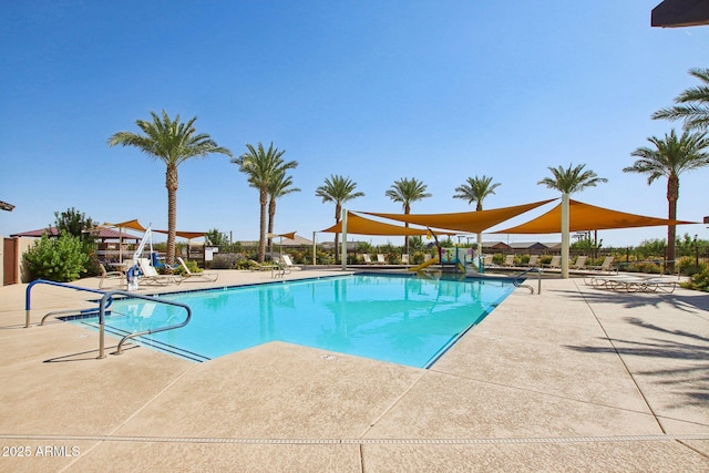community pool with a patio area