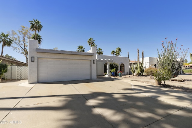 10005 E Michigan Ave, Sun Lakes, AZ 85248 - view of front of property featuring stucco siding, driveway, an attached garage, and fence