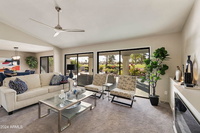 living room featuring carpet flooring, ceiling fan, and lofted ceiling