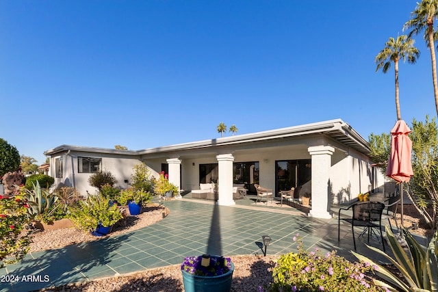 rear view of house with a patio area