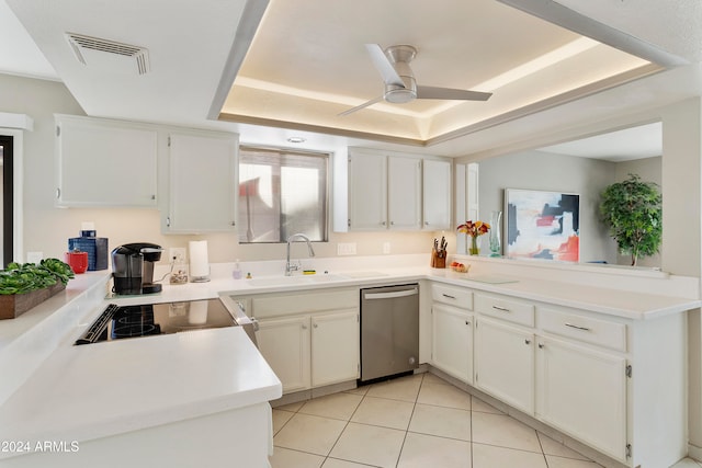 kitchen featuring dishwasher, white cabinets, light tile patterned floors, and sink