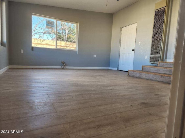 spare room with light hardwood / wood-style floors