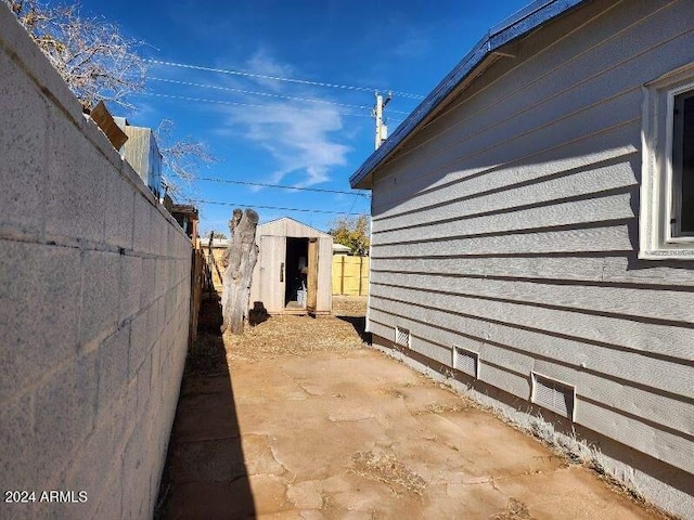 view of property exterior with a patio