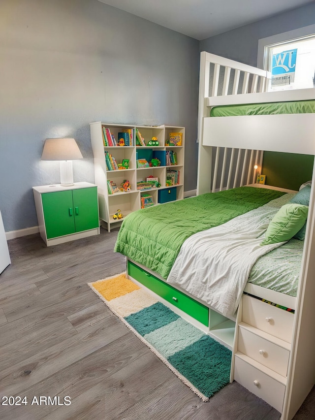 bedroom with hardwood / wood-style floors