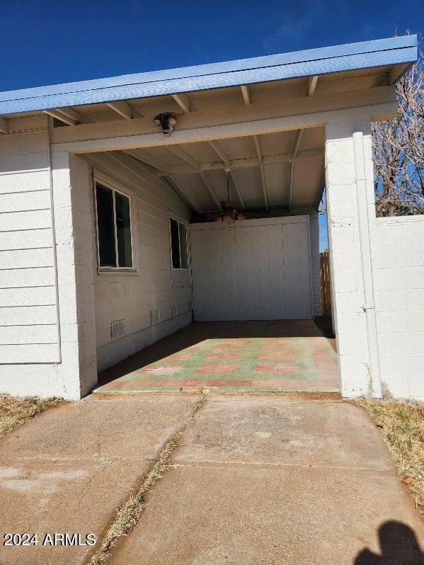 view of parking with a carport