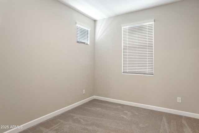 5815 E Covey Ln, Phoenix, AZ 85054 - carpeted spare room with baseboards