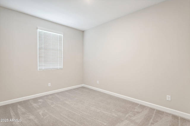 5815 E Covey Ln, Phoenix, AZ 85054 - unfurnished room featuring light carpet and baseboards