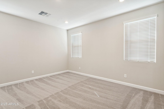 5815 E Covey Ln, Phoenix, AZ 85054 - unfurnished room featuring light colored carpet, baseboards, and recessed lighting