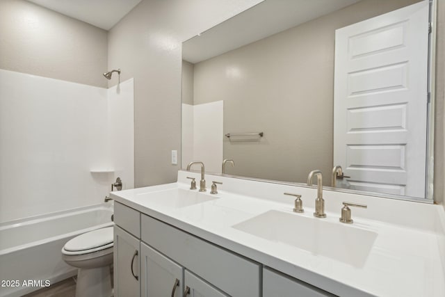 5815 E Covey Ln, Phoenix, AZ 85054 - bathroom featuring toilet, double vanity, and shower / bath combination