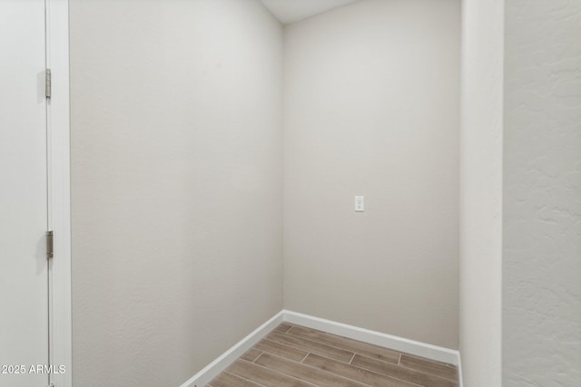 5815 E Covey Ln, Phoenix, AZ 85054 - empty room featuring light wood-style flooring and baseboards