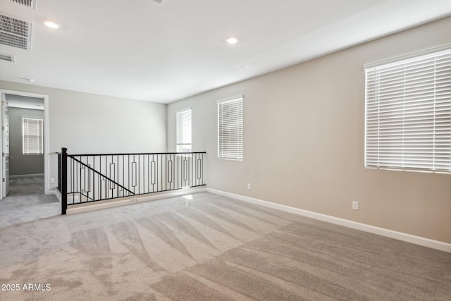 5815 E Covey Ln, Phoenix, AZ 85054 - spare room featuring carpet, baseboards, and recessed lighting