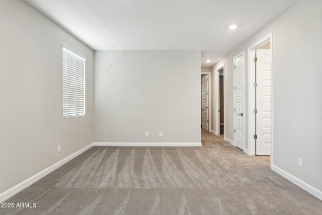 5815 E Covey Ln, Phoenix, AZ 85054 - unfurnished bedroom featuring carpet flooring, baseboards, and recessed lighting
