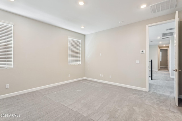 5815 E Covey Ln, Phoenix, AZ 85054 - unfurnished room with carpet flooring, baseboards, and recessed lighting
