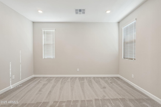 5815 E Covey Ln, Phoenix, AZ 85054 - empty room featuring light colored carpet, baseboards, and recessed lighting