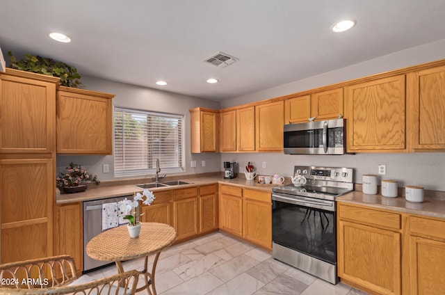 kitchen with appliances with stainless steel finishes and sink