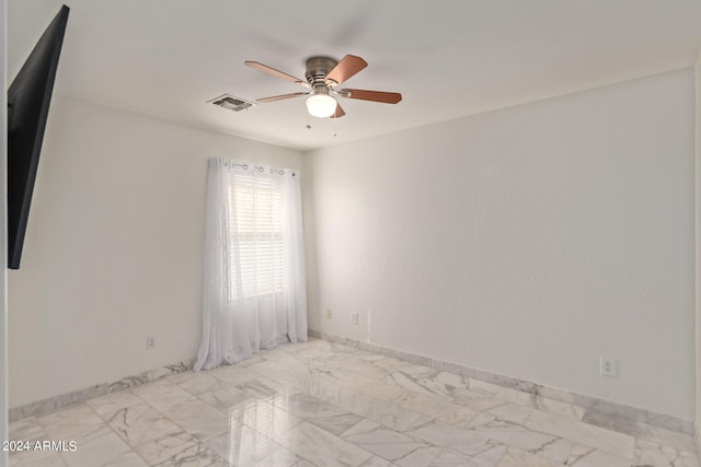 unfurnished room featuring ceiling fan