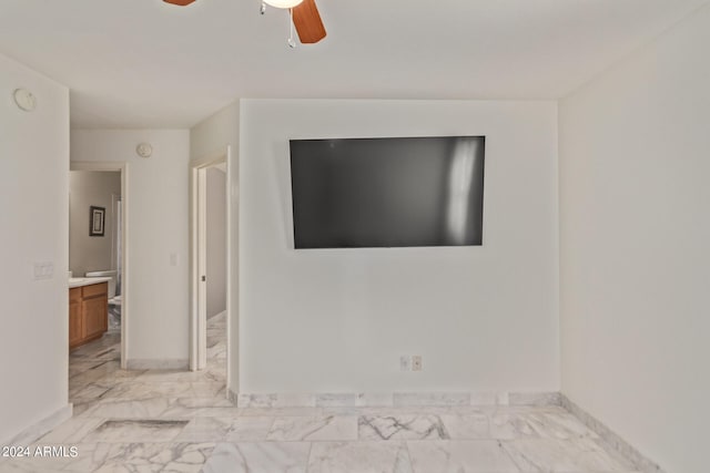 unfurnished living room featuring ceiling fan