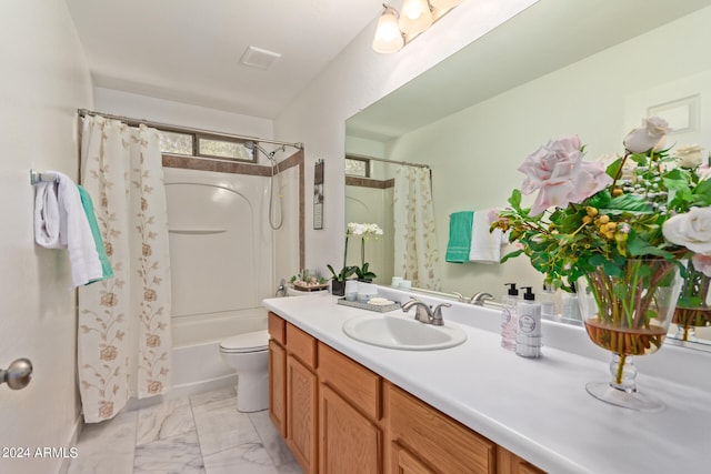 full bathroom with vanity, toilet, and shower / bath combo with shower curtain