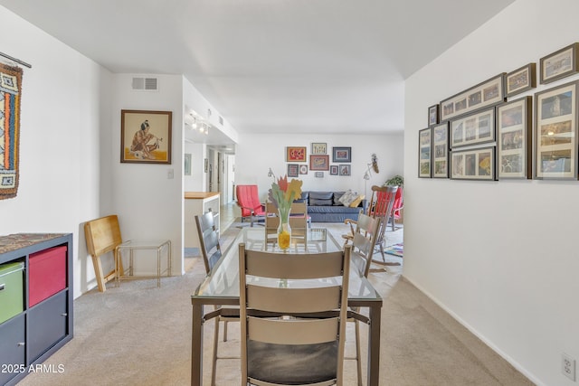 dining area with light carpet