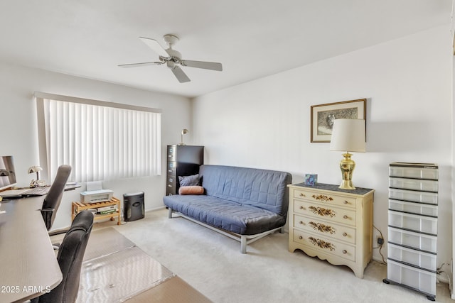 office space with light colored carpet and ceiling fan